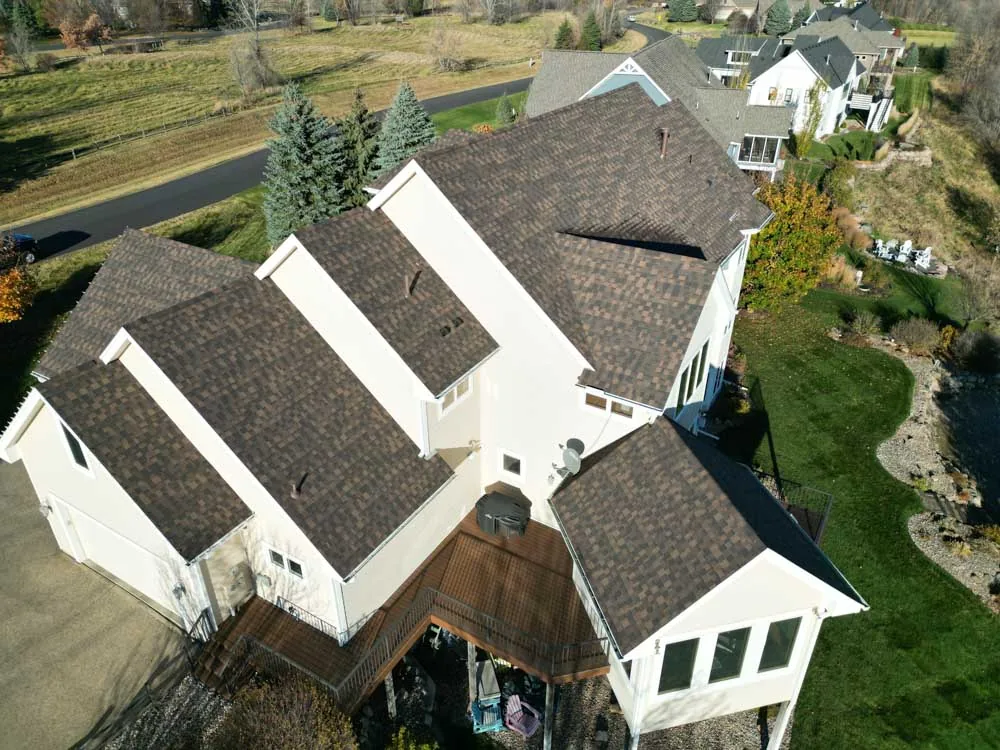 Roofing contractor performing a hail damage roof inspection in Lakeville MN